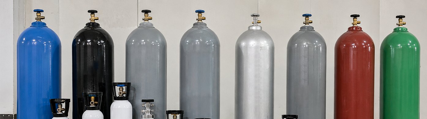 Bank of industrial and food-grade gas cylinders with valves fitted