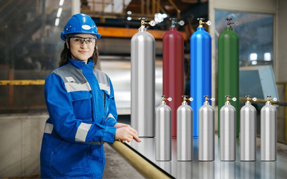 Technician beside a bank of food-grade gas cylinders in a trade store